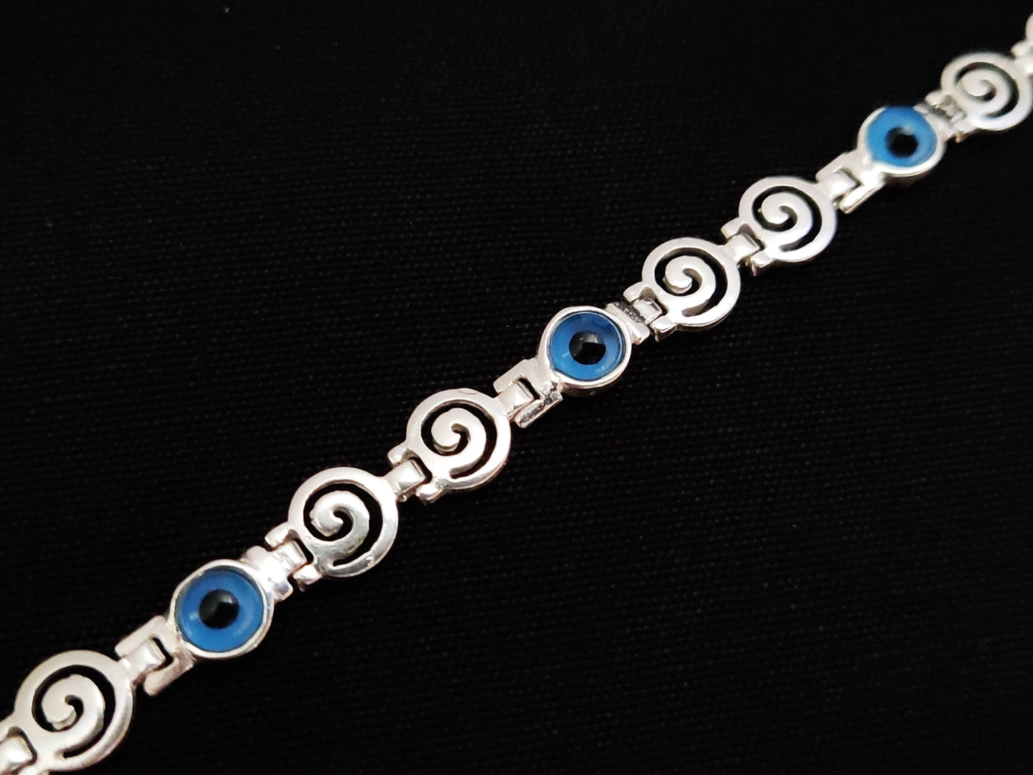 Spiral Greek bracelet with the evil eye design.